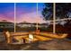Cozy outdoor fire pit with seating area and sunset views at 805 Islebay Dr, Apollo Beach, FL 33572