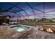 Resort-style pool and spa with fire pit at 805 Islebay Dr, Apollo Beach, FL 33572