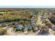 Aerial view of a residential neighborhood with houses and landscaping at 8436 Red Roe Dr, New Port Richey, FL 34653