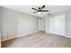 Spacious bedroom with double doors and ceiling fan at 8436 Red Roe Dr, New Port Richey, FL 34653