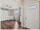 Bright entryway with hardwood floors and a view into a room at 8436 Red Roe Dr, New Port Richey, FL 34653
