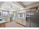 Kitchen with stainless steel appliances and light wood cabinets at 8436 Red Roe Dr, New Port Richey, FL 34653