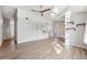Bright living room featuring hardwood floors and a ceiling fan at 8436 Red Roe Dr, New Port Richey, FL 34653