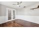 Light-filled office with wood floors and double doors at 8436 Red Roe Dr, New Port Richey, FL 34653