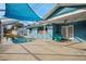 Inviting pool and patio with a shaded seating area at 8436 Red Roe Dr, New Port Richey, FL 34653