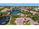 Aerial view of community with pool and lake at 10263 Gandy N Blvd # 107, St Petersburg, FL 33702