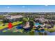 Aerial view of community pool, clubhouse, and lake at 10263 Gandy N Blvd # 107, St Petersburg, FL 33702