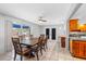 Bright dining room with large table, sliding doors to patio and kitchen views at 1340 Williams Dr, Clearwater, FL 33764