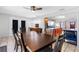 Dining area with a large wooden table and access to the backyard at 1340 Williams Dr, Clearwater, FL 33764