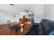 Open living room with hardwood floors and a view into the kitchen at 1340 Williams Dr, Clearwater, FL 33764