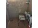 Shower with tiled walls and shower chair, needs cleaning at 1608 S 45Th St, Tampa, FL 33619
