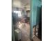 Bedroom with dresser and chair, showing significant water damage at 1608 S 45Th St, Tampa, FL 33619