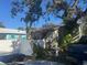 Light green single story home with mature trees at 1608 S 45Th St, Tampa, FL 33619