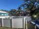 House with a white vinyl fence and palm tree at 1608 S 45Th St, Tampa, FL 33619