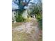 Home exterior with overgrown yard at 1608 S 45Th St, Tampa, FL 33619