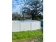 Home with a white vinyl fence and lush green landscaping at 1608 S 45Th St, Tampa, FL 33619