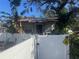 Small house with white picket fence and mature trees at 1608 S 45Th St, Tampa, FL 33619