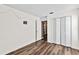 Bedroom with wood flooring, neutral walls and double door closet at 19346 Garden Quilt Cir, Lutz, FL 33558