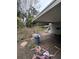 Backyard with wooden deck, trash can, and bicycle at 2733 34Th N Ave, St Petersburg, FL 33713