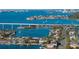 Wide aerial showcasing waterfront homes and bridge at 307 Harbor View Ln, Largo, FL 33770