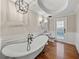 Elegant bathroom with freestanding tub and hardwood floors at 307 Harbor View Ln, Largo, FL 33770