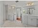 Bathroom boasts double vanity and herringbone tile floors at 307 Harbor View Ln, Largo, FL 33770