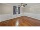 Well-lit bedroom with hardwood floors and neutral-toned walls at 307 Harbor View Ln, Largo, FL 33770