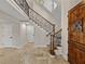 Elegant entryway with a grand staircase and ornate railing at 307 Harbor View Ln, Largo, FL 33770