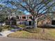 Beautiful home with mature oak tree and a long driveway at 307 Harbor View Ln, Largo, FL 33770