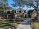 Spacious home with a large yard and a circular driveway at 307 Harbor View Ln, Largo, FL 33770