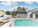 Large pool with patio furniture and pergola at 3775 Springhill Cir, Palm Harbor, FL 34684