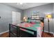 Bright bedroom with a queen bed and double closets at 6210 S Harold Ave, Tampa, FL 33616