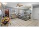 Living room with gray couches, tiled floor and a large mirror at 6210 S Harold Ave, Tampa, FL 33616