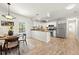 Modern kitchen with stainless steel appliances and breakfast bar at 683 Orangewood Dr, Dunedin, FL 34698