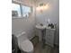 Clean bathroom with pedestal sink and modern fixtures at 700 16Th Nw St, Largo, FL 33770