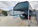 Backyard with metal storage shed and covered carport at 7211 Waycross Ave, Tampa, FL 33619