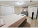 Main bedroom with gray platform bed and ample closet space at 7211 Waycross Ave, Tampa, FL 33619