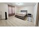 Cozy bedroom with gray wood-like platform bed at 7211 Waycross Ave, Tampa, FL 33619