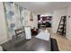 Open dining area, view of kitchen and living room at 7211 Waycross Ave, Tampa, FL 33619