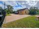 Nice yellow house with a large brick driveway at 7211 Waycross Ave, Tampa, FL 33619