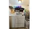 Laundry room with washer, dryer, and storage shelves at 7211 Waycross Ave, Tampa, FL 33619