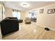 Open living room with view of dining area at 7211 Waycross Ave, Tampa, FL 33619