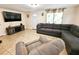 Spacious living room with large sectional sofa at 7211 Waycross Ave, Tampa, FL 33619