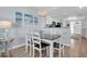 Bright dining area with table and chairs, open to living room at 12000 Gulf Blvd # 603N, Treasure Island, FL 33706