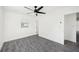 Spacious bedroom featuring grey flooring and a ceiling fan at 1903 E Diana St, Tampa, FL 33610