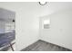 Small bedroom with wood-look floors and view of living room at 1903 E Diana St, Tampa, FL 33610