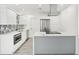 Modern kitchen with island, stainless steel appliances, and white cabinets at 1903 E Diana St, Tampa, FL 33610