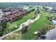 Aerial view of community near golf course and water at 2400 Feather Sound Dr # 418, Clearwater, FL 33762