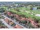 Aerial view of community with golf course and condo building at 2400 Feather Sound Dr # 418, Clearwater, FL 33762