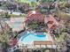 Aerial view of community pool, tennis courts, and clubhouse at 2400 Feather Sound Dr # 418, Clearwater, FL 33762